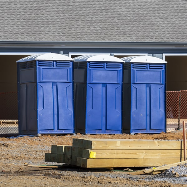 what is the cost difference between standard and deluxe portable restroom rentals in Quinque